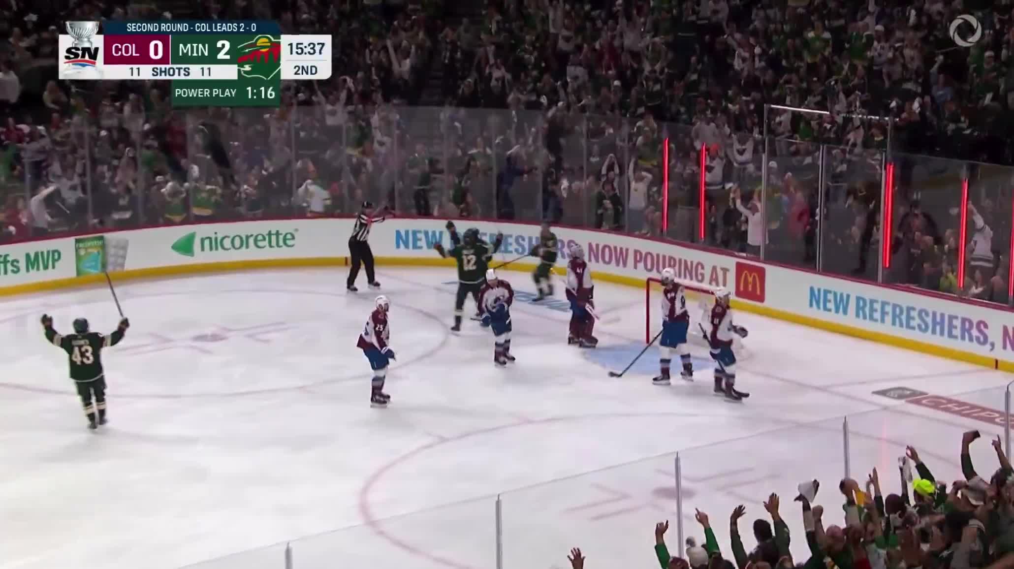 RYAN HARTMAN BATS THE PUCK IN OUT OF MIDAIR TO MAKE IT 3-0 WILD