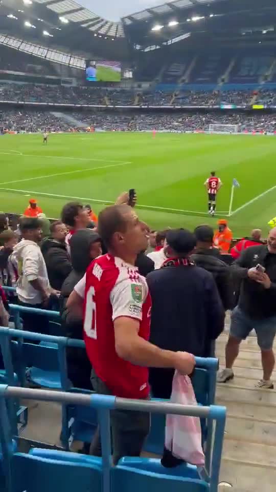 An Arsenal fan in the Brentford section at the Etihad, as Manchester City hosted the Bees