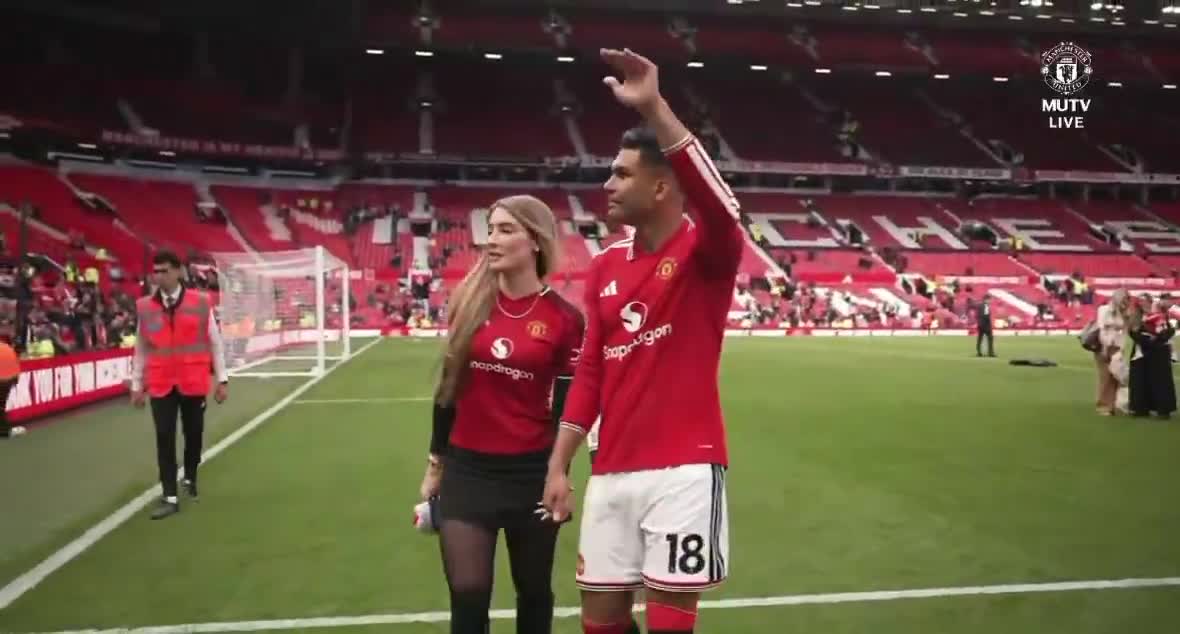 Casemiro leaves the Old trafford pitch with his wife