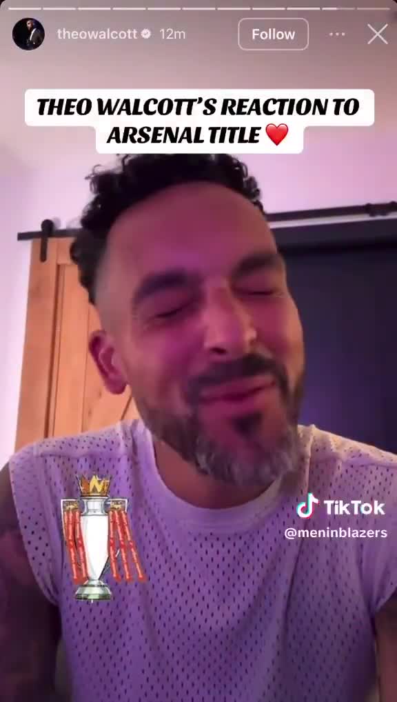 Theo Walcott reacts to Arsenal winning the Premier League