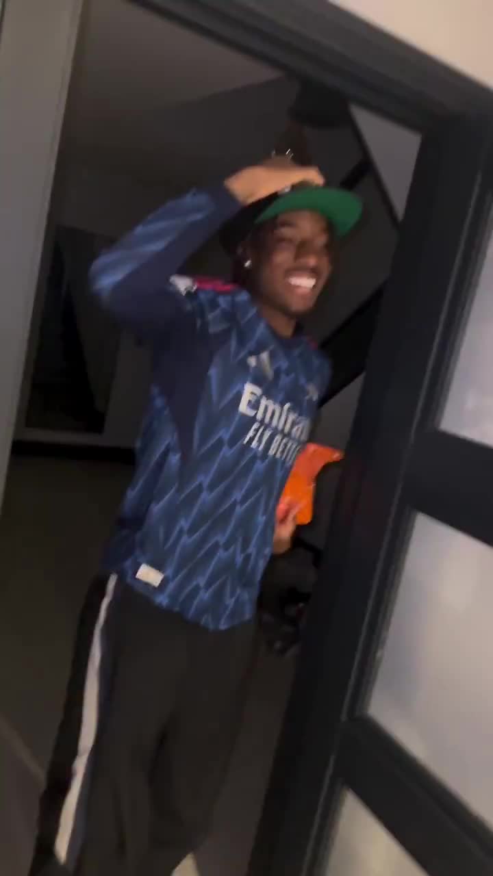 Noni Madueke being greeted by his mother as he returned home as a Premier League champion