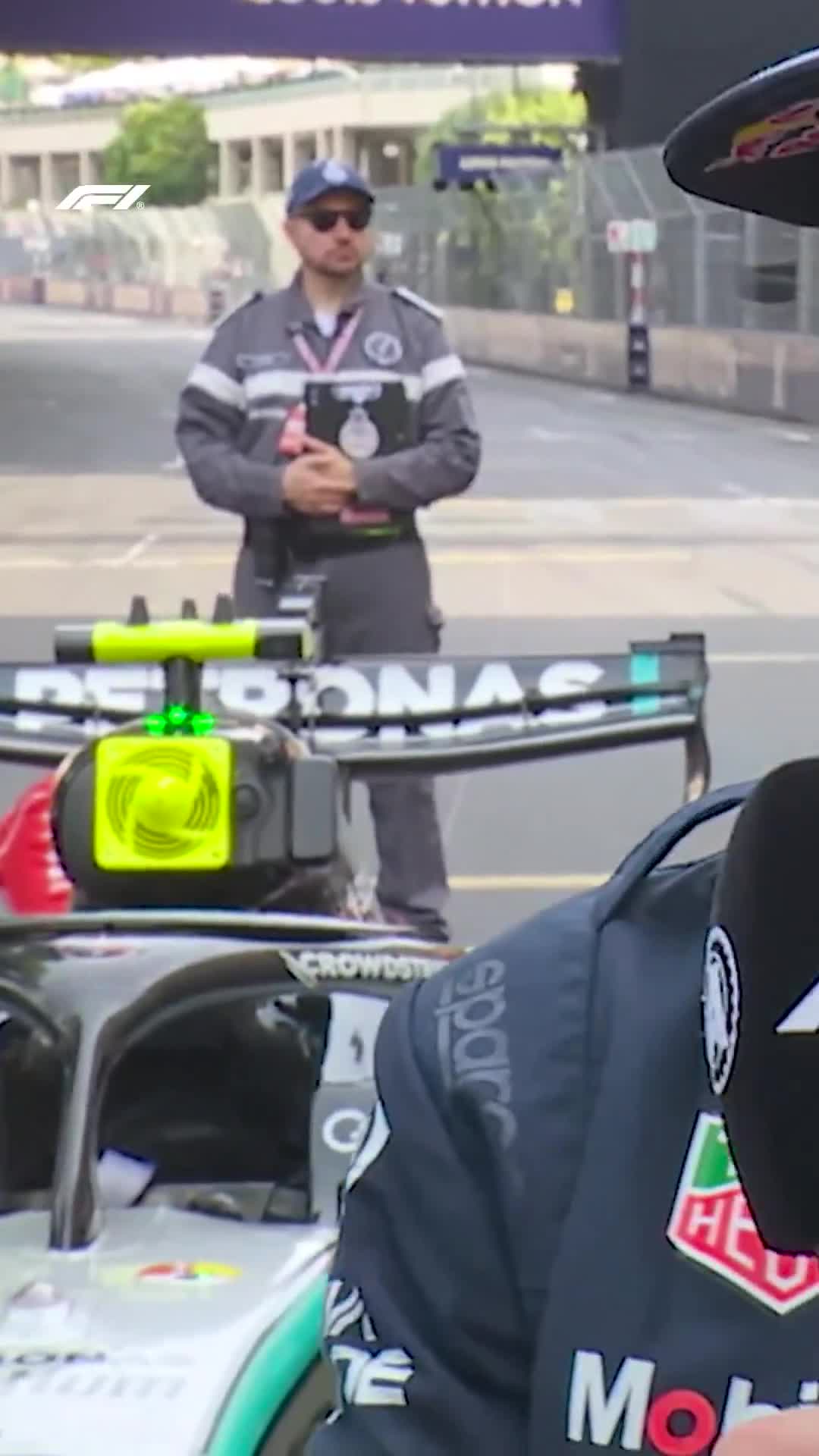 Lewis Hamilton spotted in the background during Isack’s interview