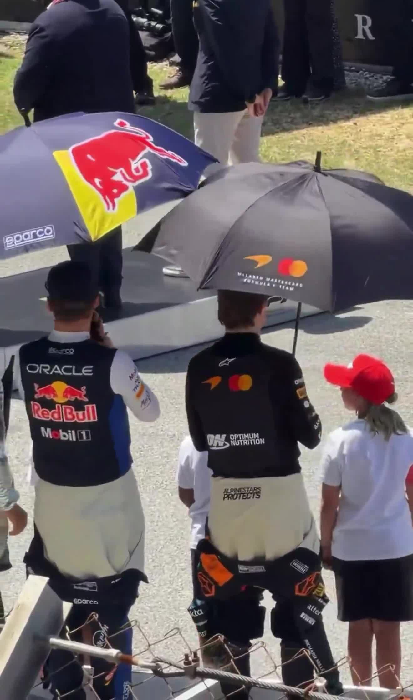 Max playing with the umbrella with Oscar