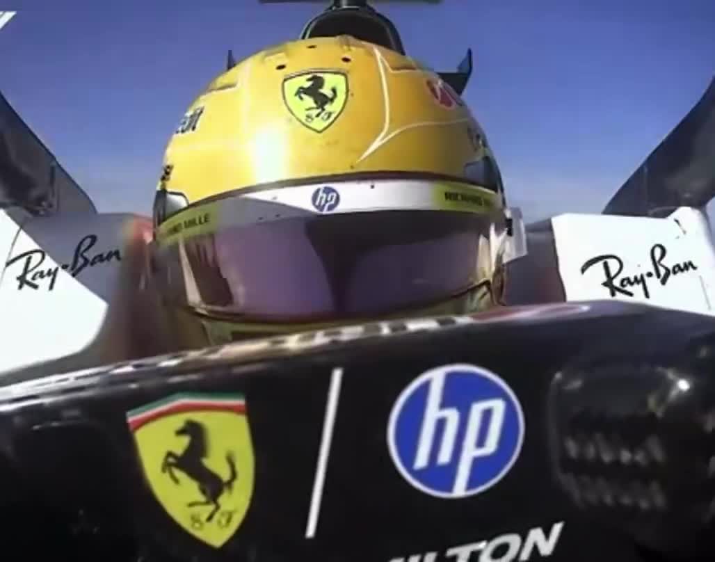 lewis patting his wheel after getting pole