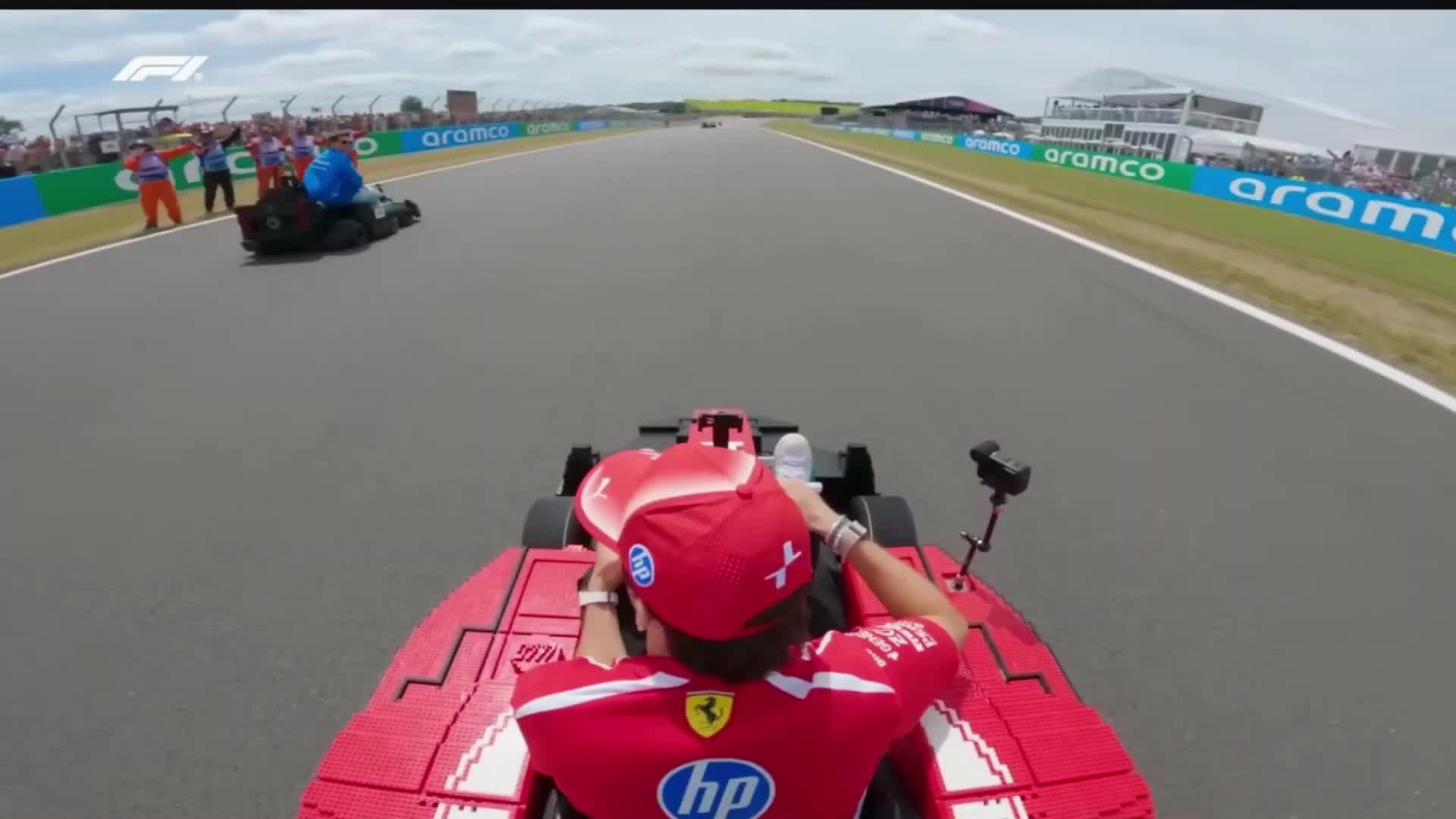 charles removing a lego piece from his car to throw at george