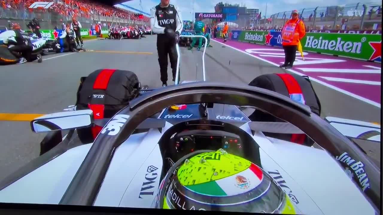 The front cat mechanic gets careless and abruptly drops Checo Pérez's Cadillac