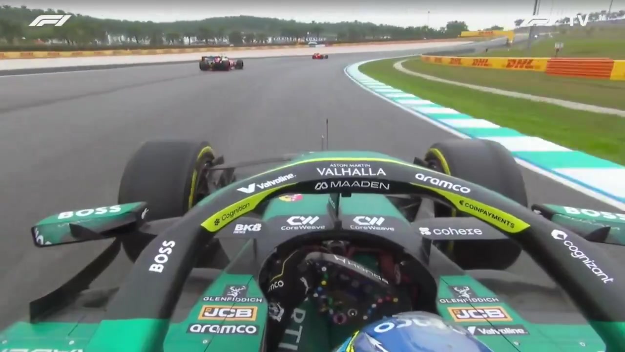Fernando Alonso passes Lewis Hamilton at the start of the race
