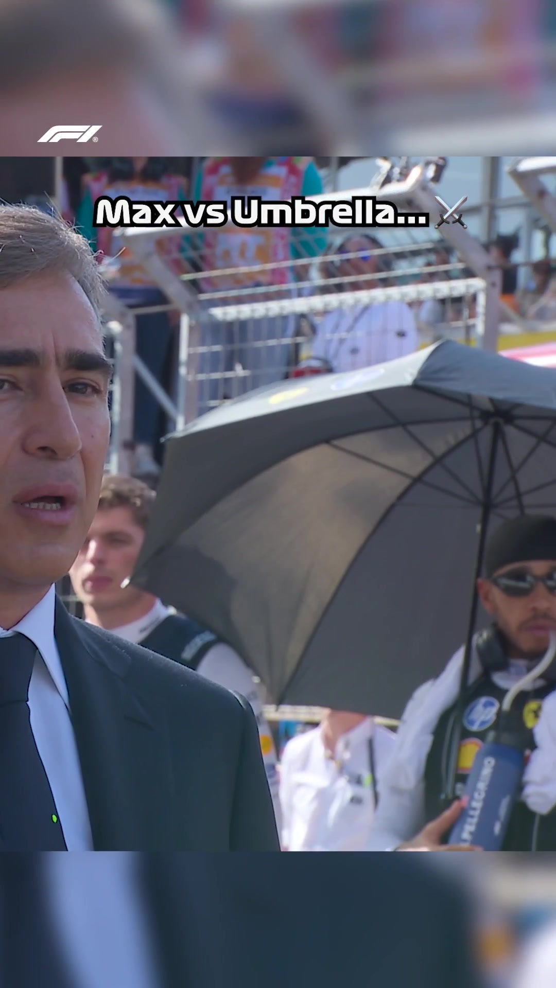 Hamilton’s umbrella makes contact with Verstappen