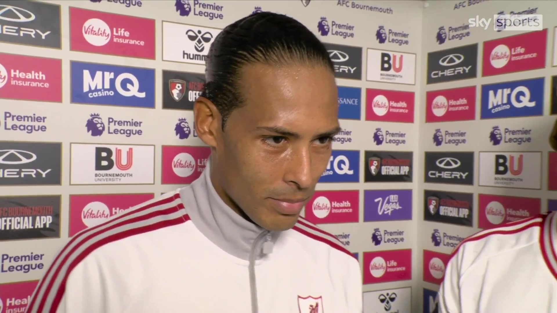 Virgil van Dijk giving Jérémy Jacquet his POTM award after Liverpool's 1-0 win at Bournemouth