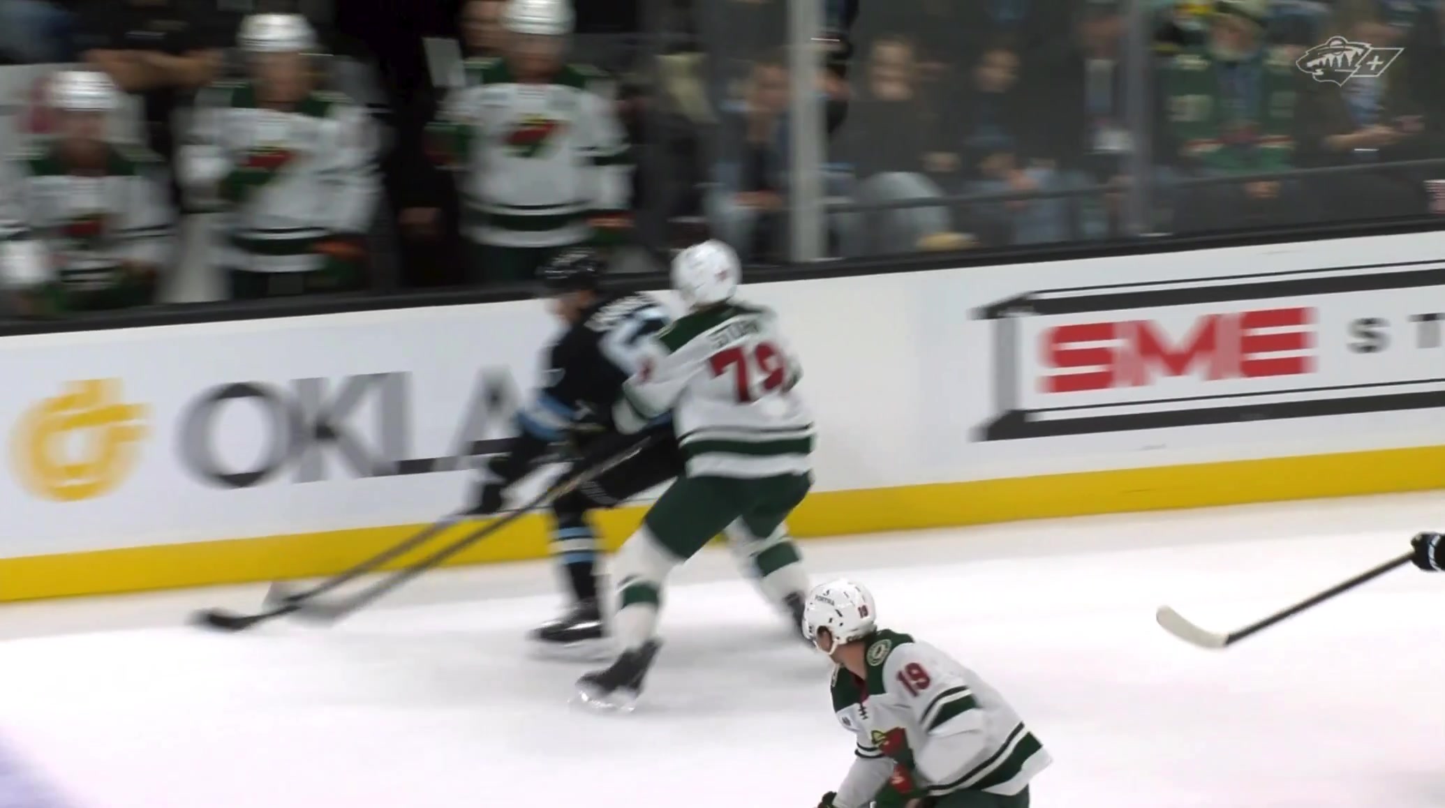 Bobby Brink FELL off the Wild bench while there was a little skirmish going on in front of him